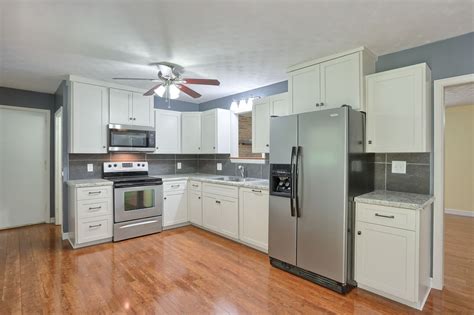 white cabinets with stainless steel appliance|remodeled kitchens with white appliances.